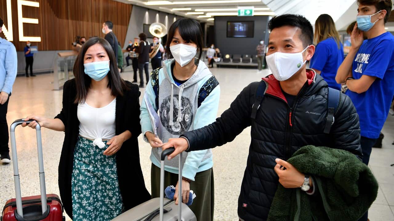 Passengers on a Singapore Airlines flight arrive at Melbourne International Airport in Melbourne, Sunday, November 21, 2021