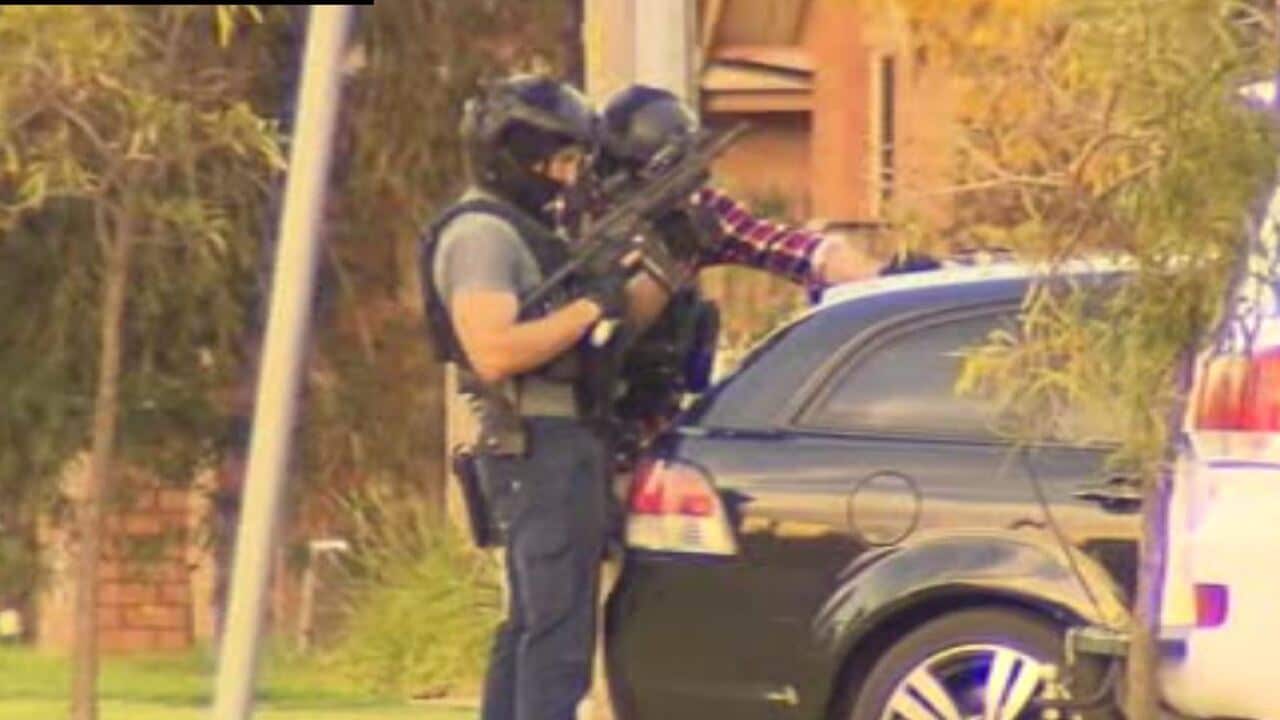 Police outside the house in Epping, where a man is refusing arrest.