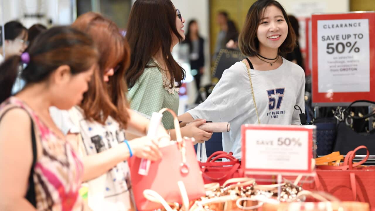 Shoppers with clearance items in Sydney