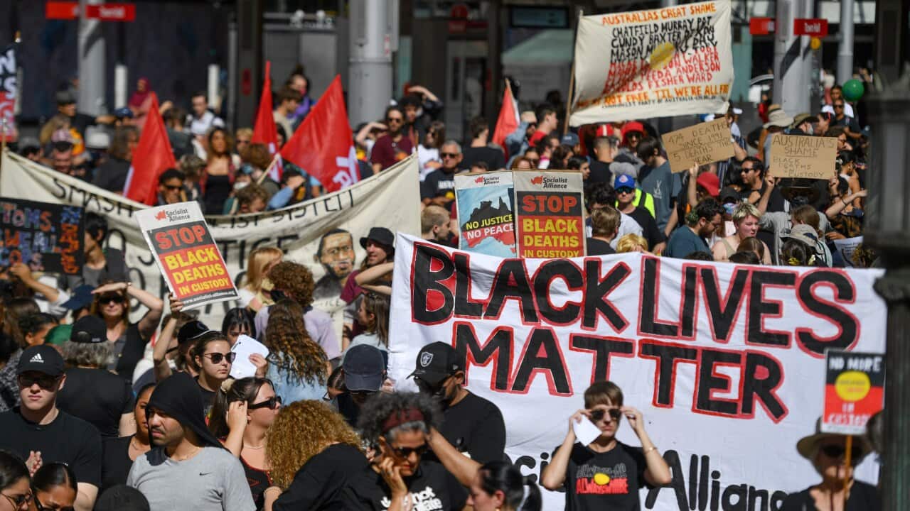 Protesters at a Black Deaths in Custody Rally at Town Hall in Sydney.
