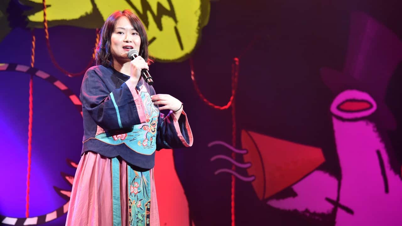 Huang He performing at the Melbourne International Comedy Festival.