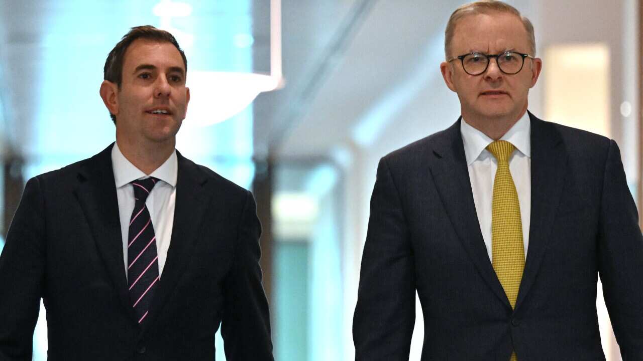 Treasurer Jim Chalmers and Prime Minister Anthony Albanese arrive at a press conference at Parliament House in Canberra on 11 July 2022.