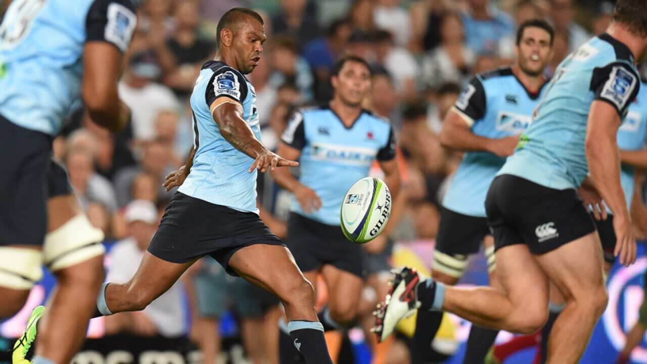 NSW Waratahs' Kurtley Beale kicks down field