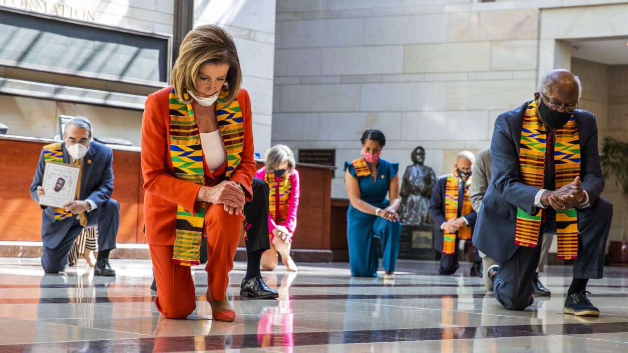 House Speaker Nancy Pelosi and other members of Congress gather at the Emancipation Hall, kneel and observe a moment of silence to honour George Floyd.