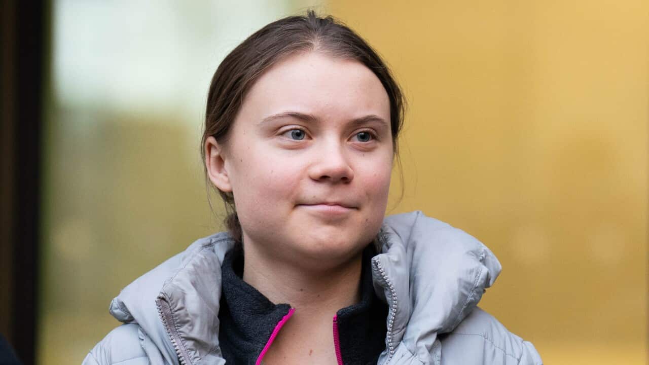 Greta Thunberg in a grey pufffer jacket