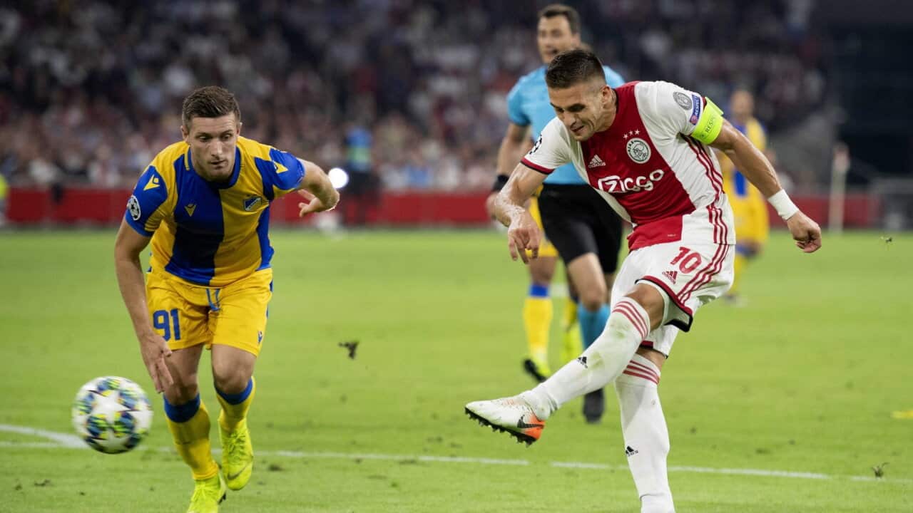 Dusan Tadic (R) of Ajax scores during the UEFA Champions League playoff second leg soccer match between Ajax Amsterdam and APOEL FC in Amsterdam.