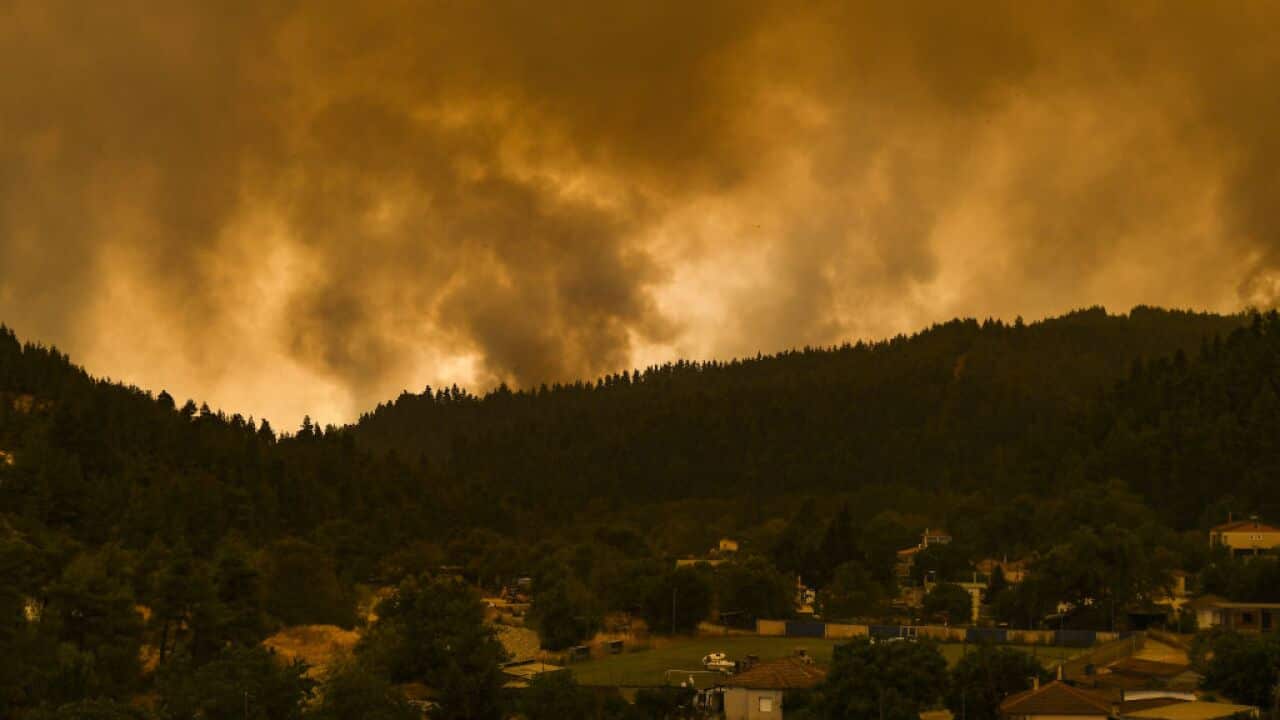 The fires surround the village of Peyki, on the island of Evia on the fifth day of a wildfire in the area, in Greece, 8 August 2021.