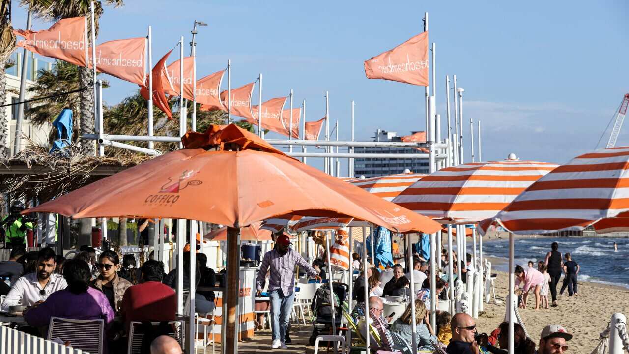 People gathering on the seashore in St Kilda, Melbourne