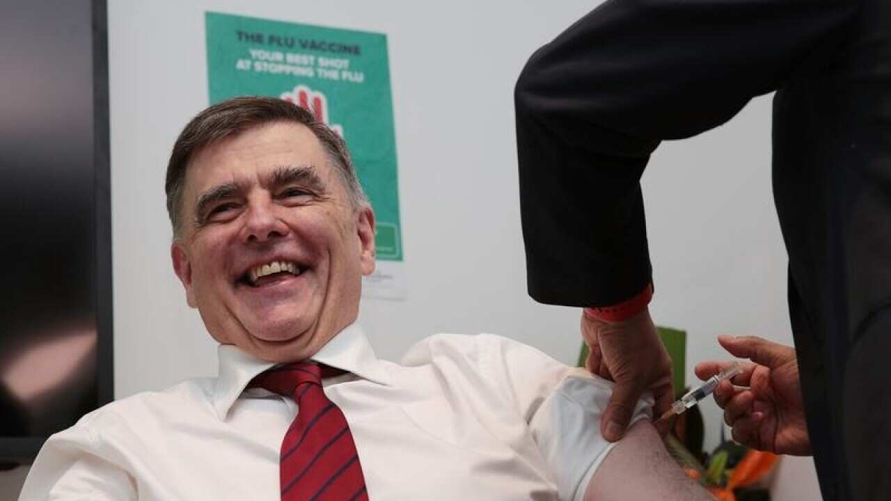Australia's Chief Medical Officer Brendan Murphy gets a flu shot.