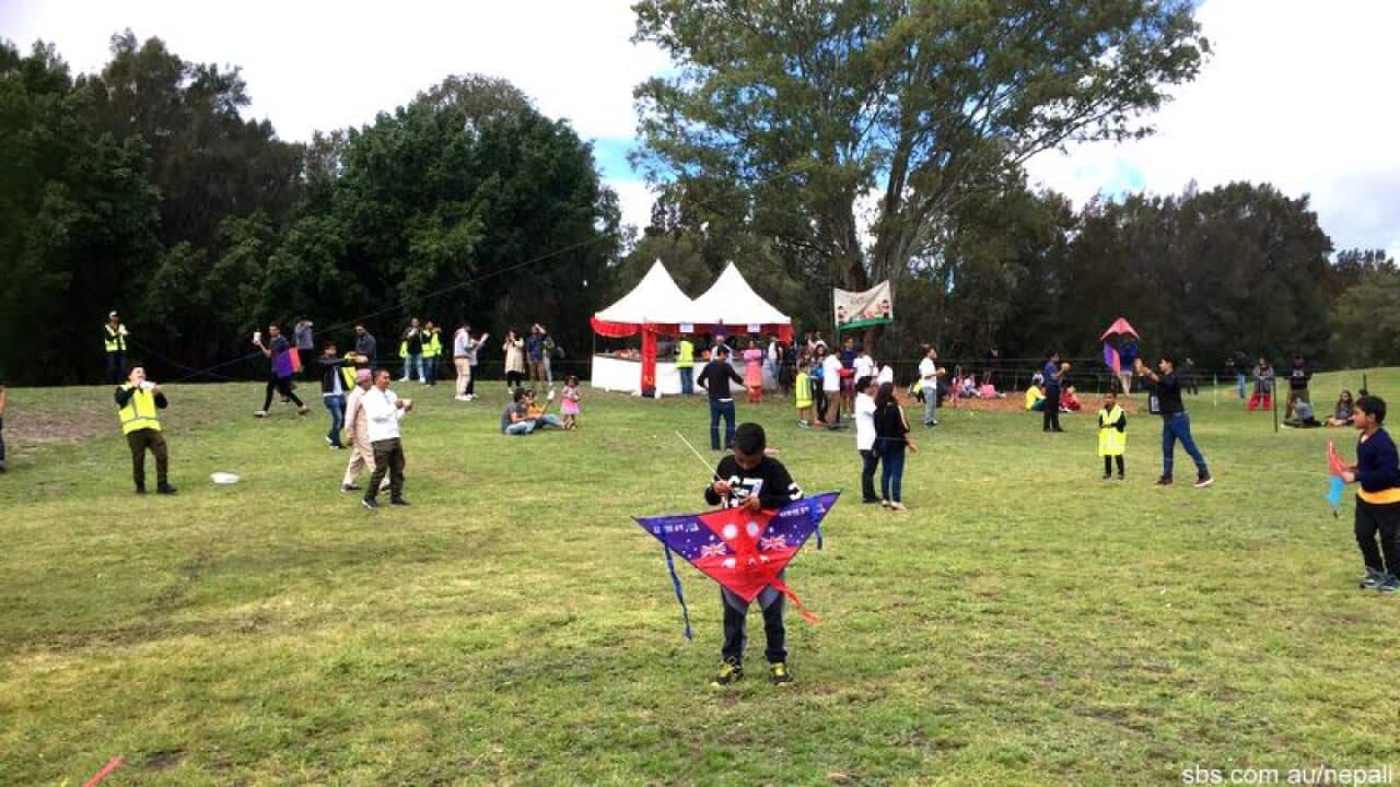 children preparing to fly kite in kites festival