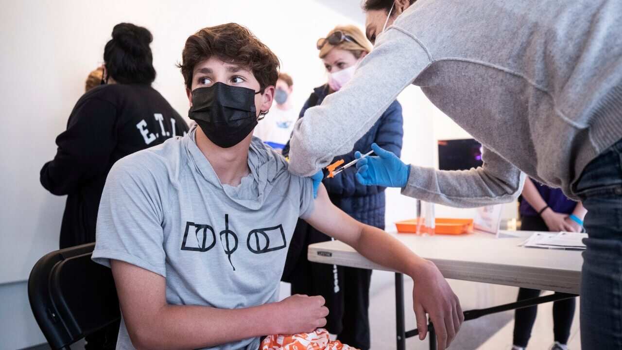 A 14-year-old boy receives a dose of COVID-19 vaccine during a vaccination drive for teenagers aged between 12 and 15 in Los Angeles, California.