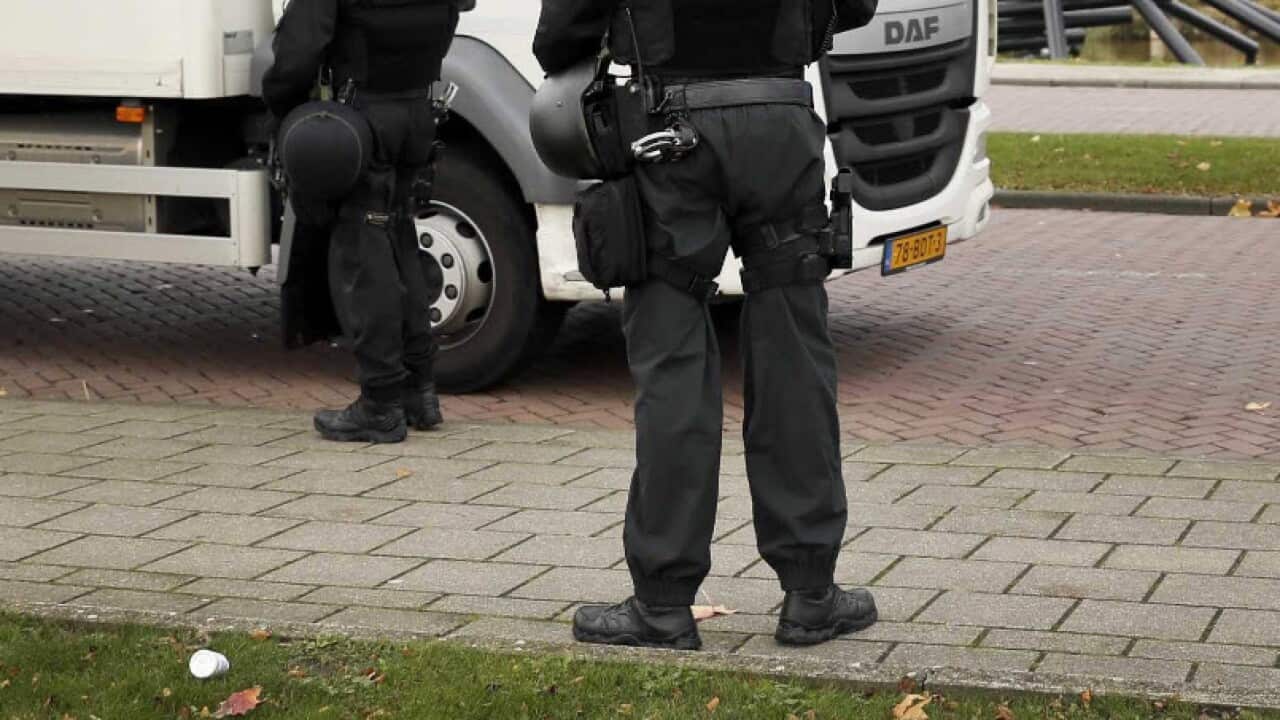 A file photo of Dutch police by a truck.