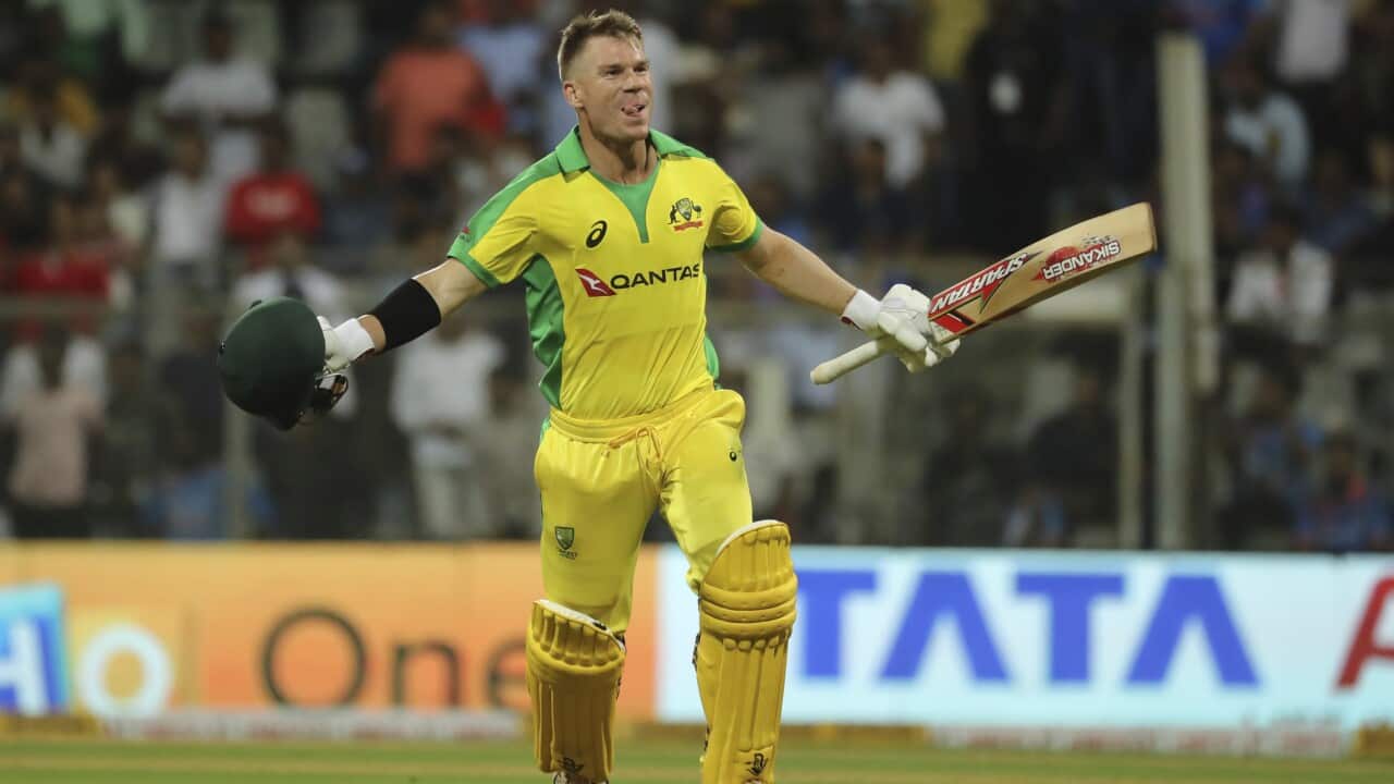 Australia's David Warner celebrates after scoring a hundred during the first one-day international cricket match between India and Australia in Mumbai, India, Tuesday, Jan. 14, 2020. (AP Photo/Rafiq Maqbool)