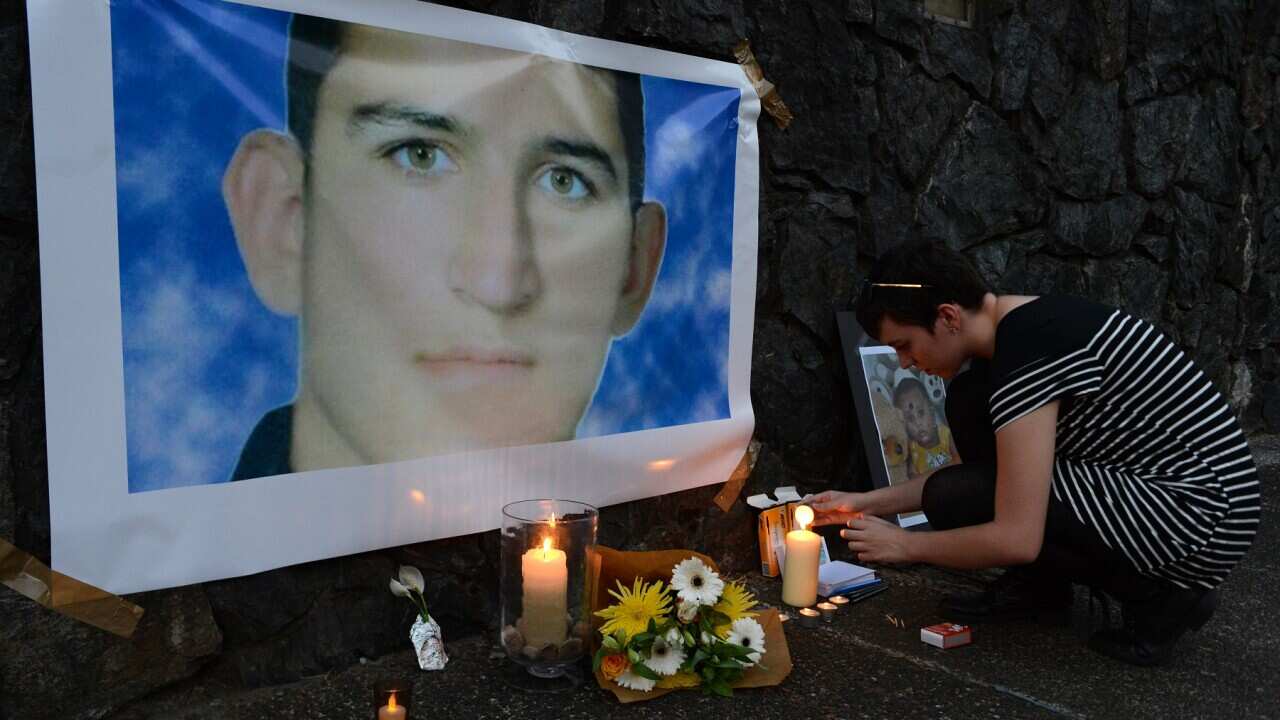 A shrine for Reza Berati at a 2014 vigil in support of asylum seekers in Brisbane