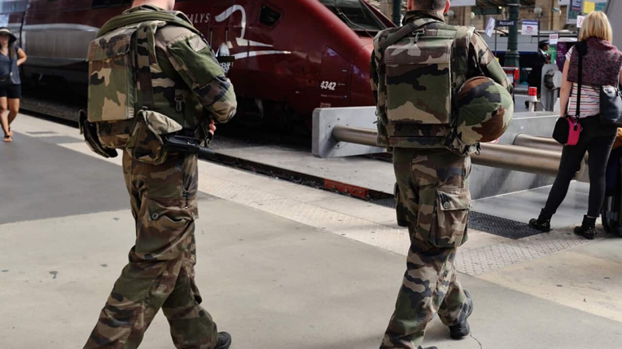 French soldiers patrol at Gare du Nord train station in Paris