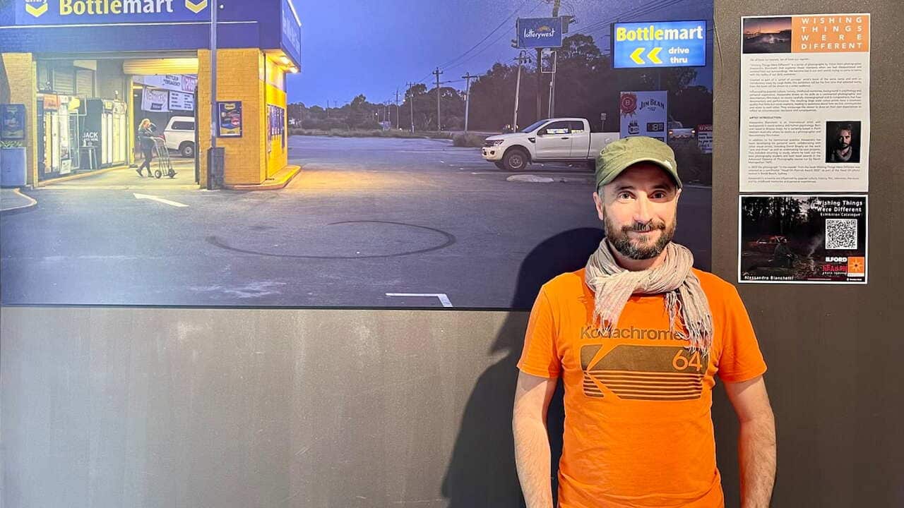 Alessandro Bianchetti in front of one of his photos