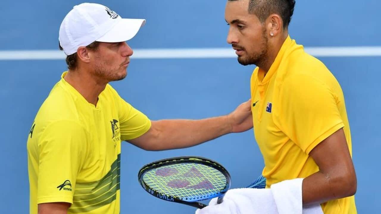 Lleyton Hewitt is seen talking to Nick Kyrgios.