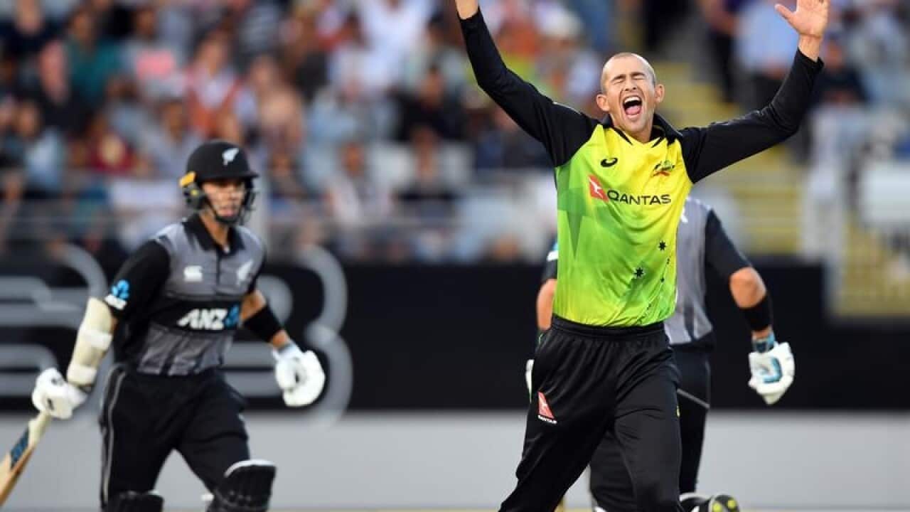 Australian bowler Ashton Agar (R) reacts after claiming a wicket