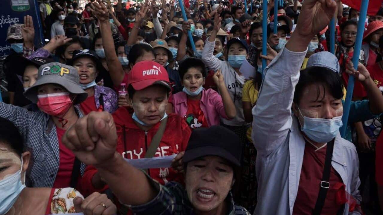 Protesters march along a street during a demonstration against the military coup in Yangon on 8 February.