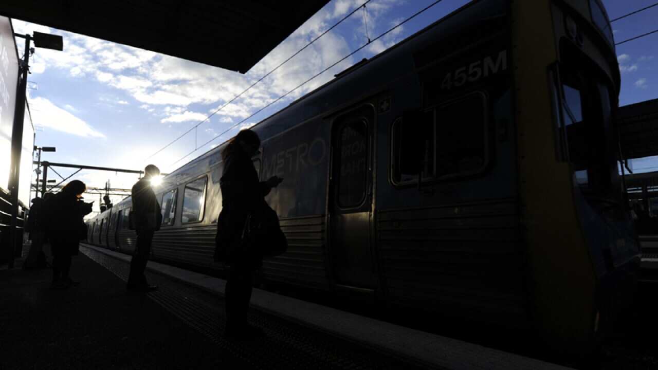 Passengers at a Melbourne train station