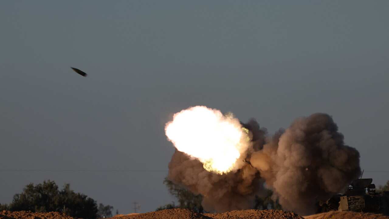 Israeli troops gather near the border with the Gaza Strip