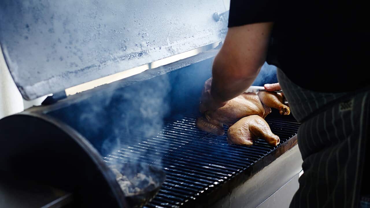 Chicken cooking on a smoker