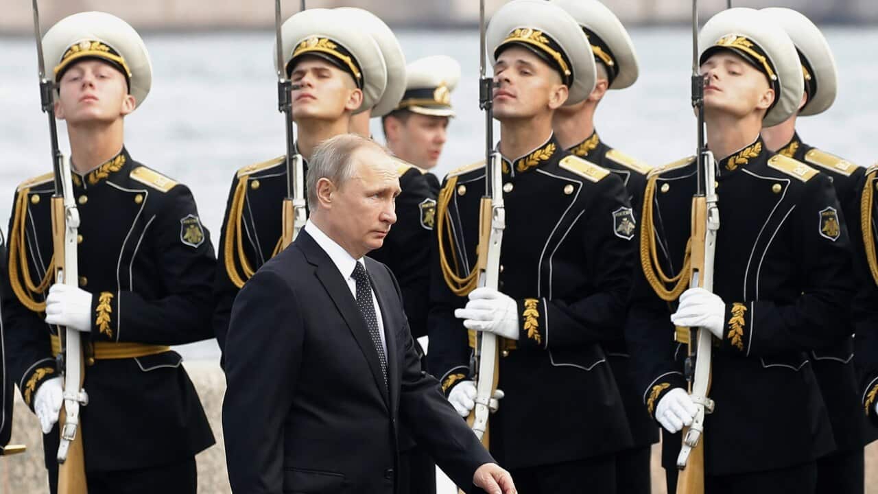 Russian President Vladimir Putin arrives to attend the military parade during the Navy Day celebration in St. Petersburg, Russia, on Sunday, July 30, 2017. (Maxim Shipenkov/Pool Photo via AP)