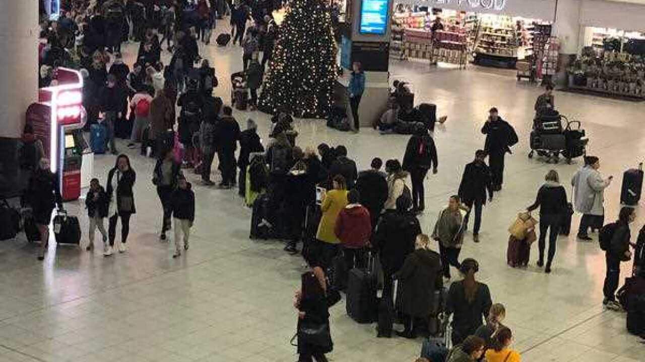 Lines of passengers at Gatwick Airport after the closure.