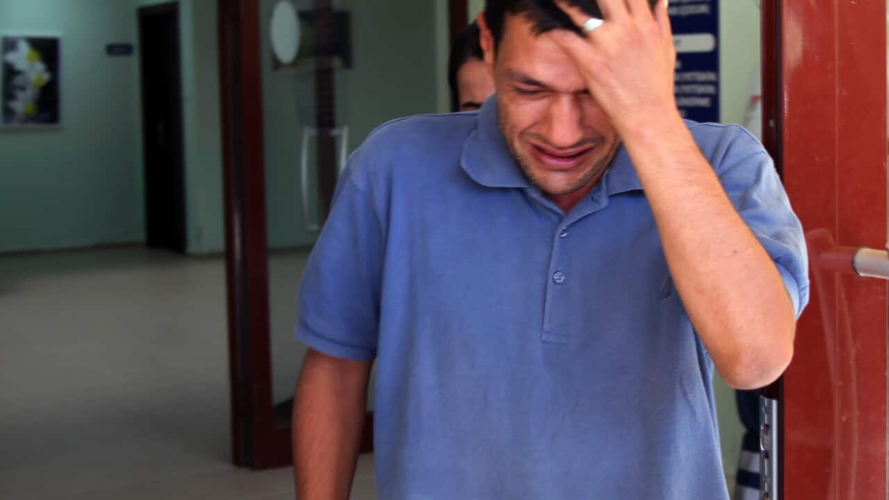 Abdullah Kurdi, 40, father of Syrian boys Aylan, 3, and Galip, 5, who were washed up drowned on a beach near Turkish resort of Bodrum on Wednesday, cries as he waits for the delivery of their bodies outside a morgue in Mugla, Turkey, Thursday, Sept. 3, 20