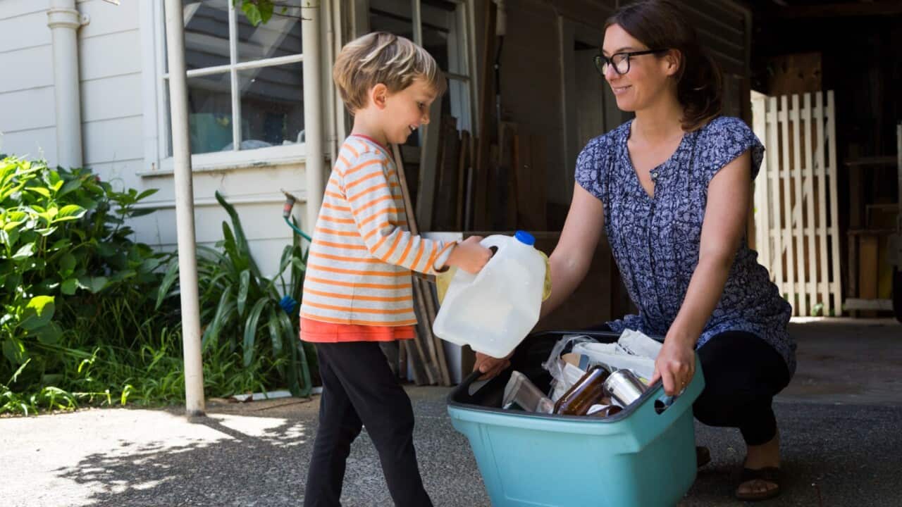 Mother and child sorting bins.jpg