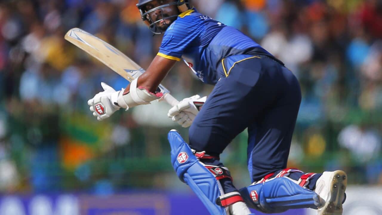 Sri Lankan cricketer Dinesh Chandimal plays a shot against Australia