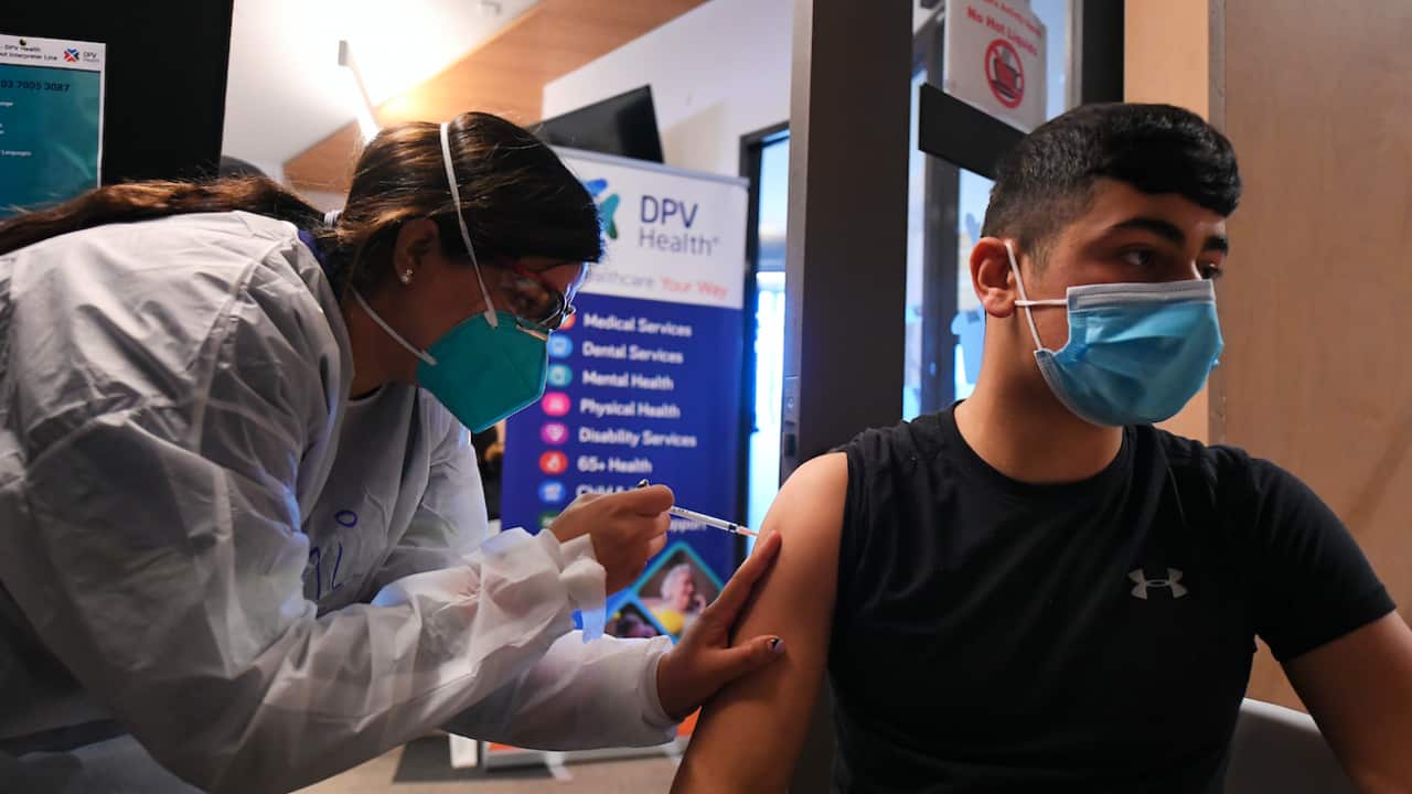 A healthcare worker administers a COVID-19 vaccine at a pop-up clinic in Broadmeadows, Melbourne