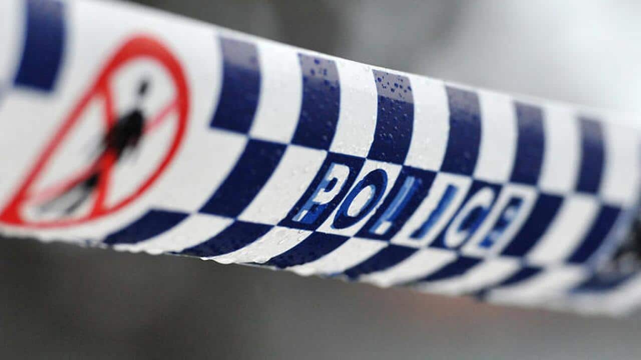 Police tape restricts access to a crime scene north of Sydney, Friday, July 24, 2015. (AAP Image/Joel Carrett) NO ARCHIVING