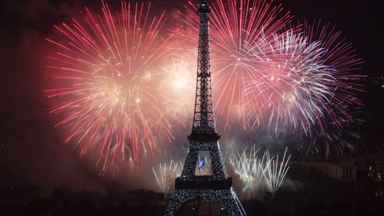 Fireworks burst around the Eiffel Tower in Paris on July 14, 2013 as part of France's annual Bastille Day celebrations.
