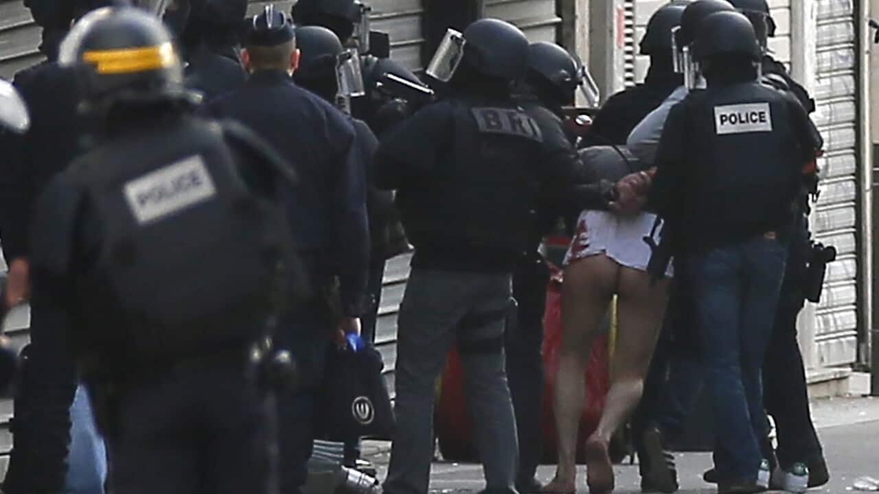 A man is arrested by police officers at the site were a raid happened in the city center of Saint Denis, near Paris, France, 18 November 2015. (EPA/IAN LANGSDON)
