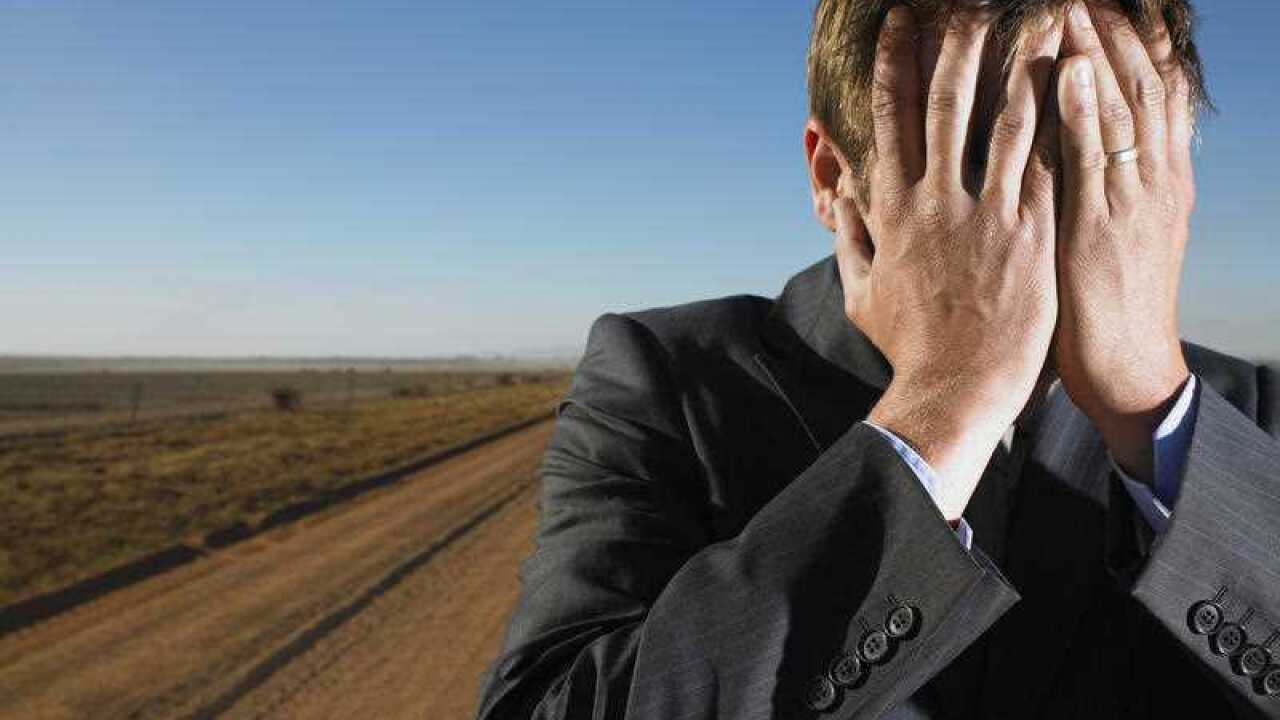 Man with head in hands