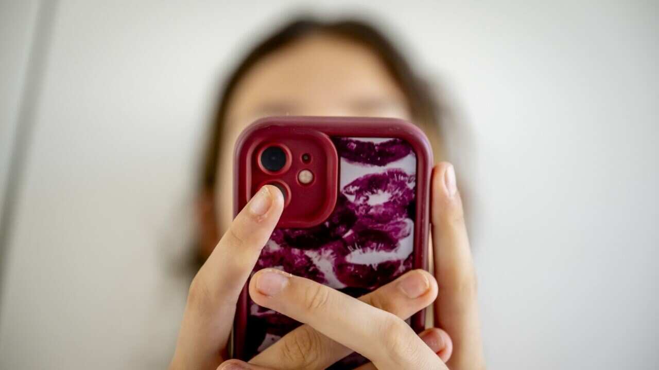 Two-thirds of study participants said they used their smartphones while sitting on the toilet (AAP).jpg