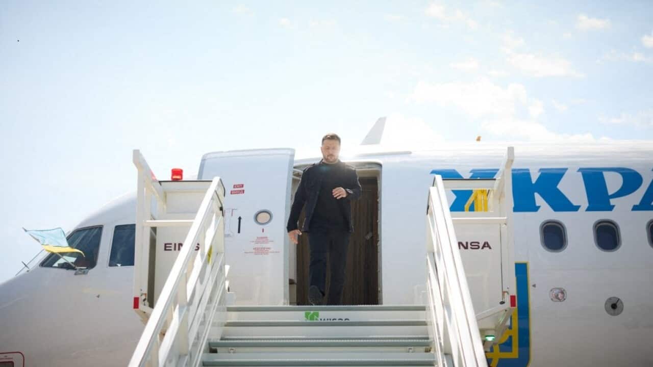 Ukrainian President Volodymyr Zelenskyy alights from a plane.