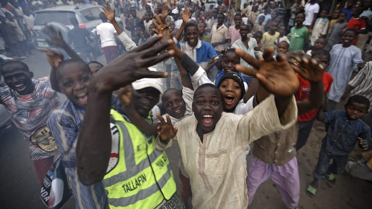 Supporters of Nigeria's President Muhammadu Buhari and young children enjoying the festivities celebrate his electoral win.