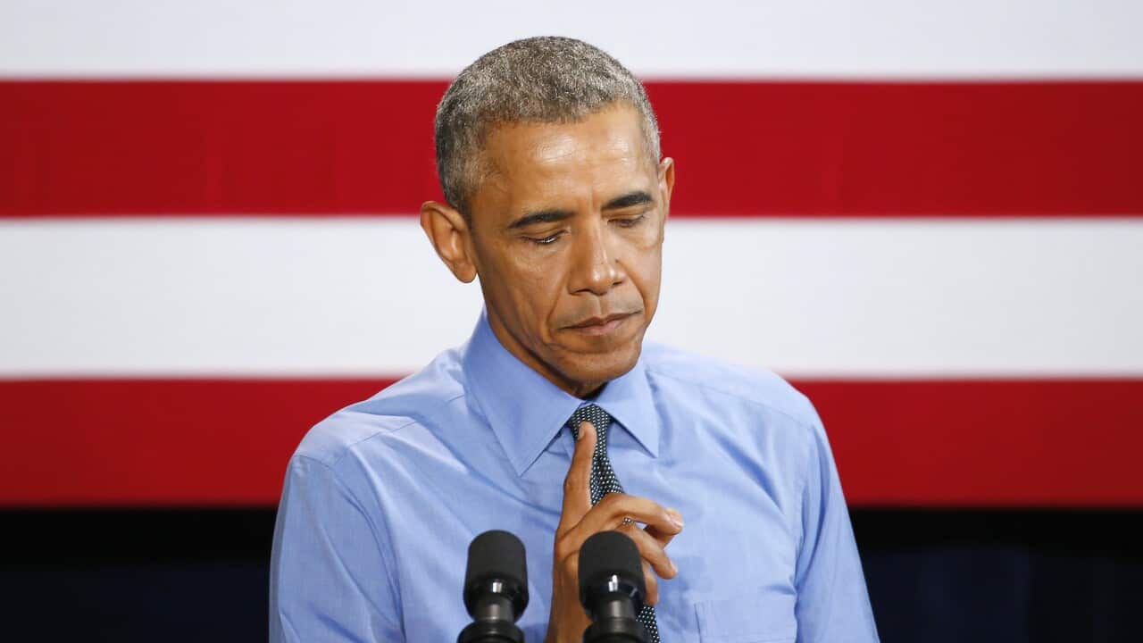 President Barack Obama pauses while speaking about Flint