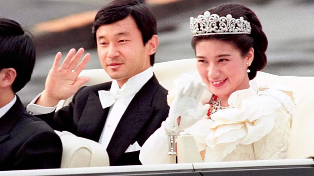 Japan's Crown Prince Naruhito (next Emperor) and Crown Princess Masako (next Empress) parade after their marriage ceremony in Tokyo on June 9, 1993.