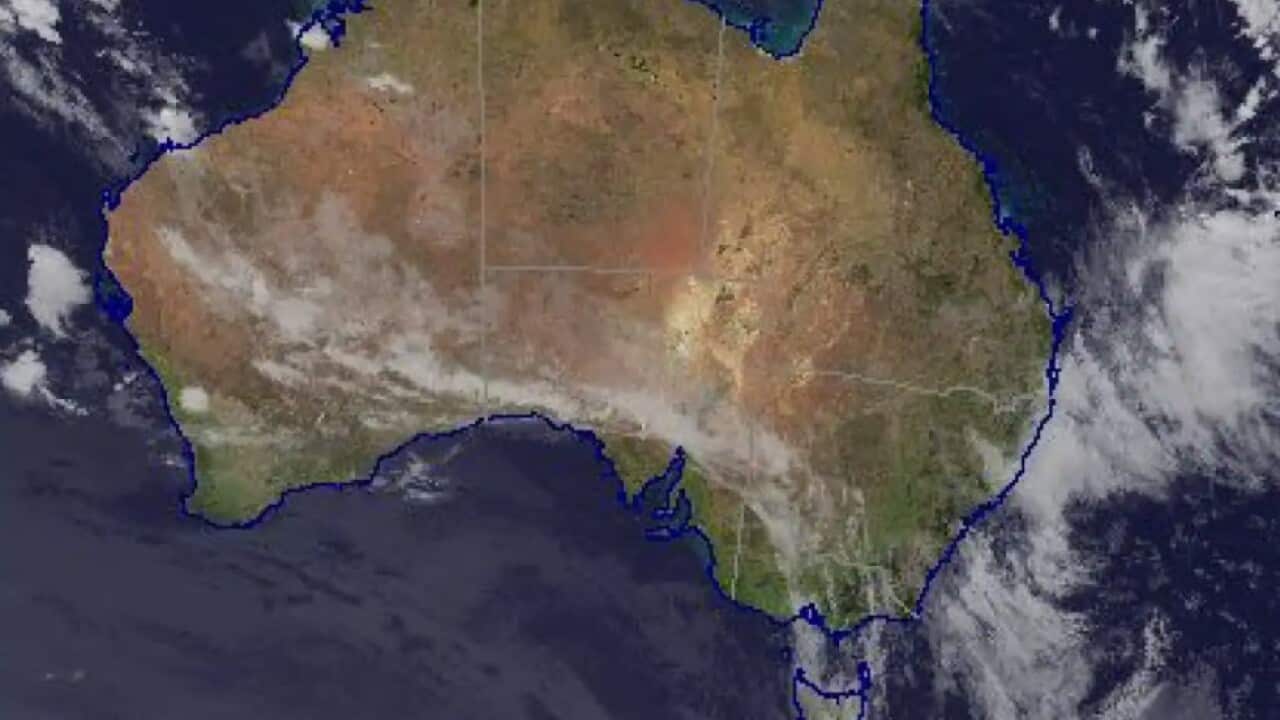 A satellite image from the Bureau of Meteorology showing rain clouds hovering over Australia's east coast