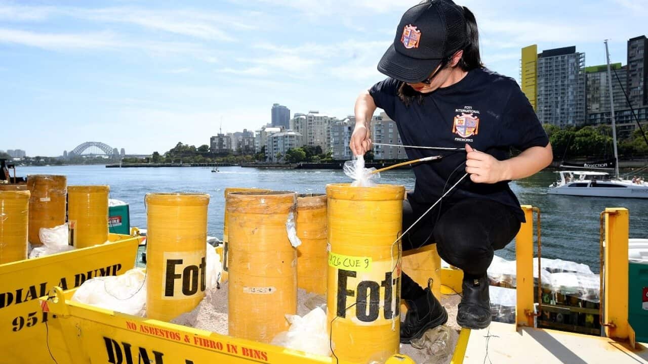 A technician packs fireworks in preparation for the New Year's Eve celebrations at Glebe Island in Sydney.