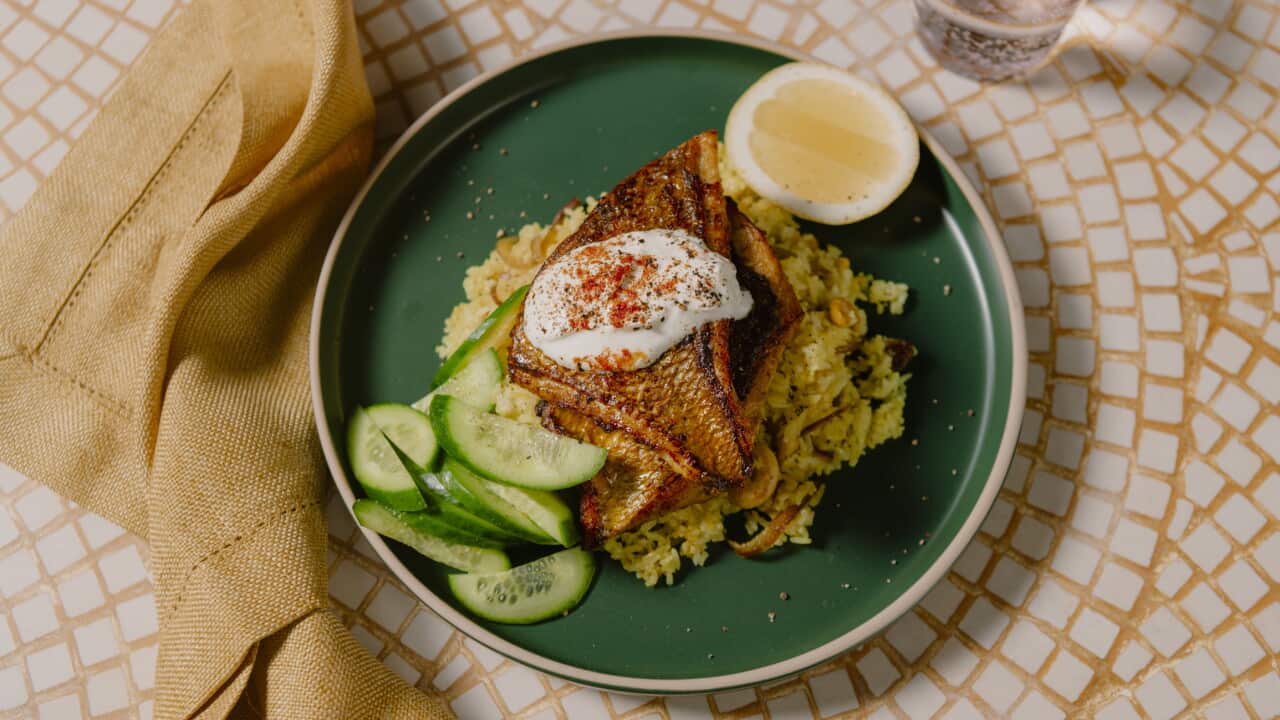 Turmeric fish on spiced rice