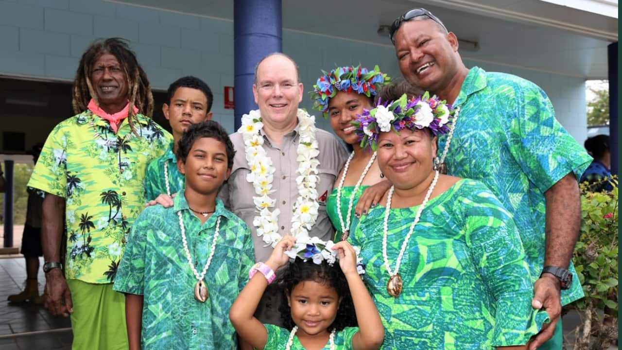 Prince Albert II with Torres Strait Artist, Alick Tipoti and his family on Badu Island