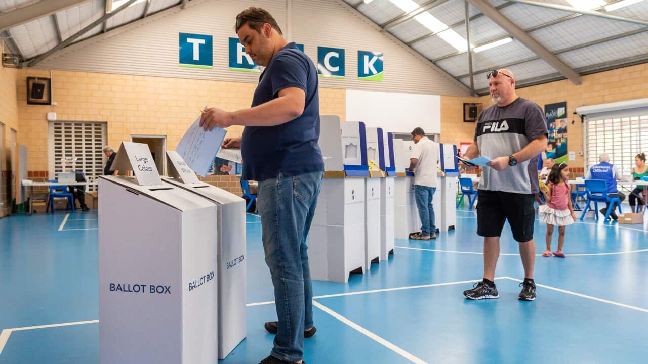 Members of the public cast their votes at a polling station in West Byford, Perth.