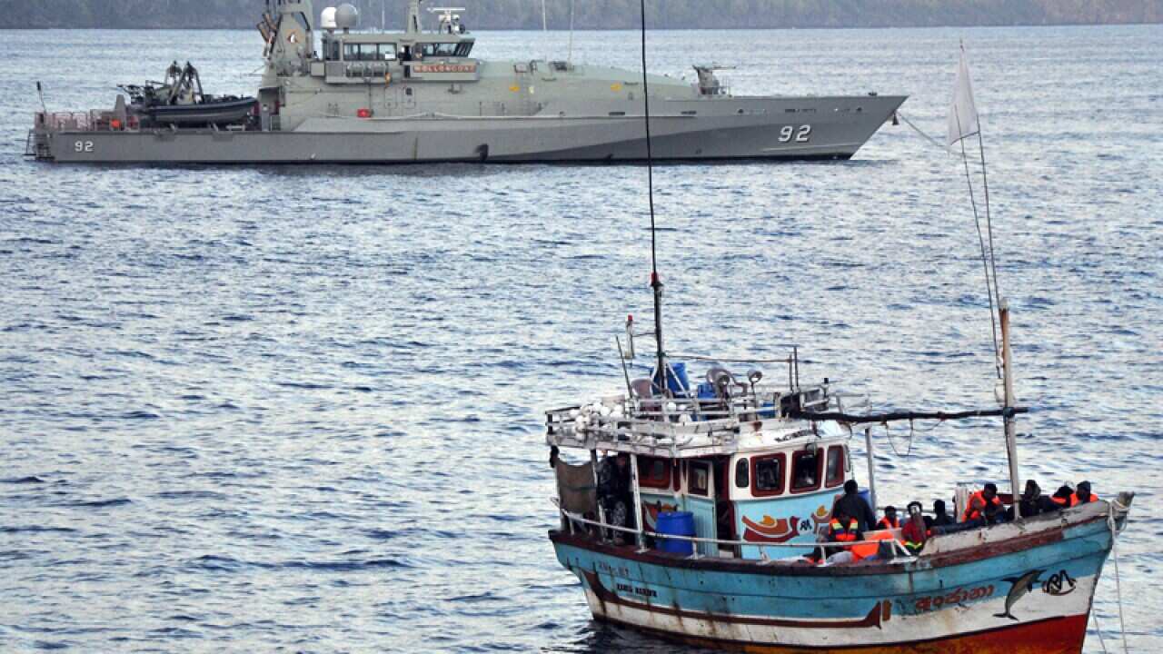 Federal authorities have intercepted two asylum seeker boats north west of the Cocos Islands.