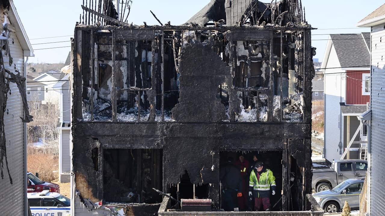 Police and firefighters investigate the scene.