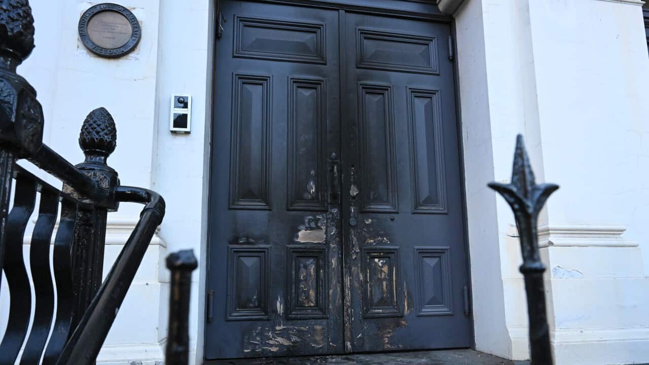 An entrance of a synagogue after a firebomb.