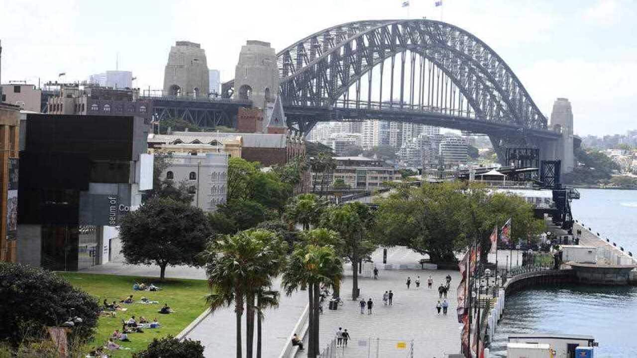 People are seen enjoying a picnic at the Museum of Contemporary Art Lawn, in Sydney, Saturday, 25 September, 2021.